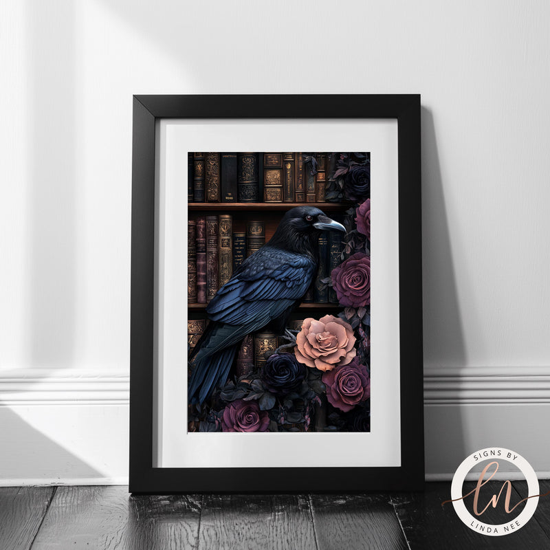 a black bird sitting on top of a book shelf