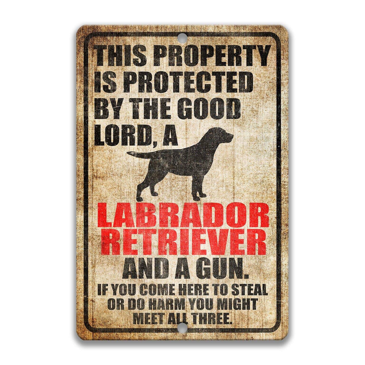 Property Protected by the Good Lord, a Labrador Retriever, and a Gun Dog Sign